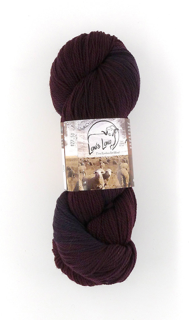 Buffalo Hills "Lava" Botanically Dyed Sport weight yarn on a Climate Beneficial Wool Base Yarn. 4 0z 3-ply skeins made and sourced in the USA. Beautiful dark burgundy with Blue undertones from using Indigo to get the dark deep lava color..