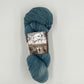 Buffalo Hills "Indigo" Botanically Dyed Sport weight yarn on a Climate Beneficial Wool Base Yarn. 4 0z 3-ply skeins made and sourced in the USA. Semi-solid dyed in house with natural Indigo.